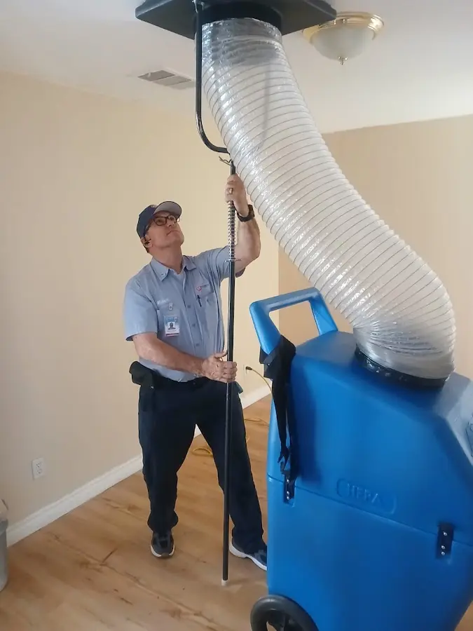 Furnace Tune-Up technician using HEPA equipment in Waxhaw